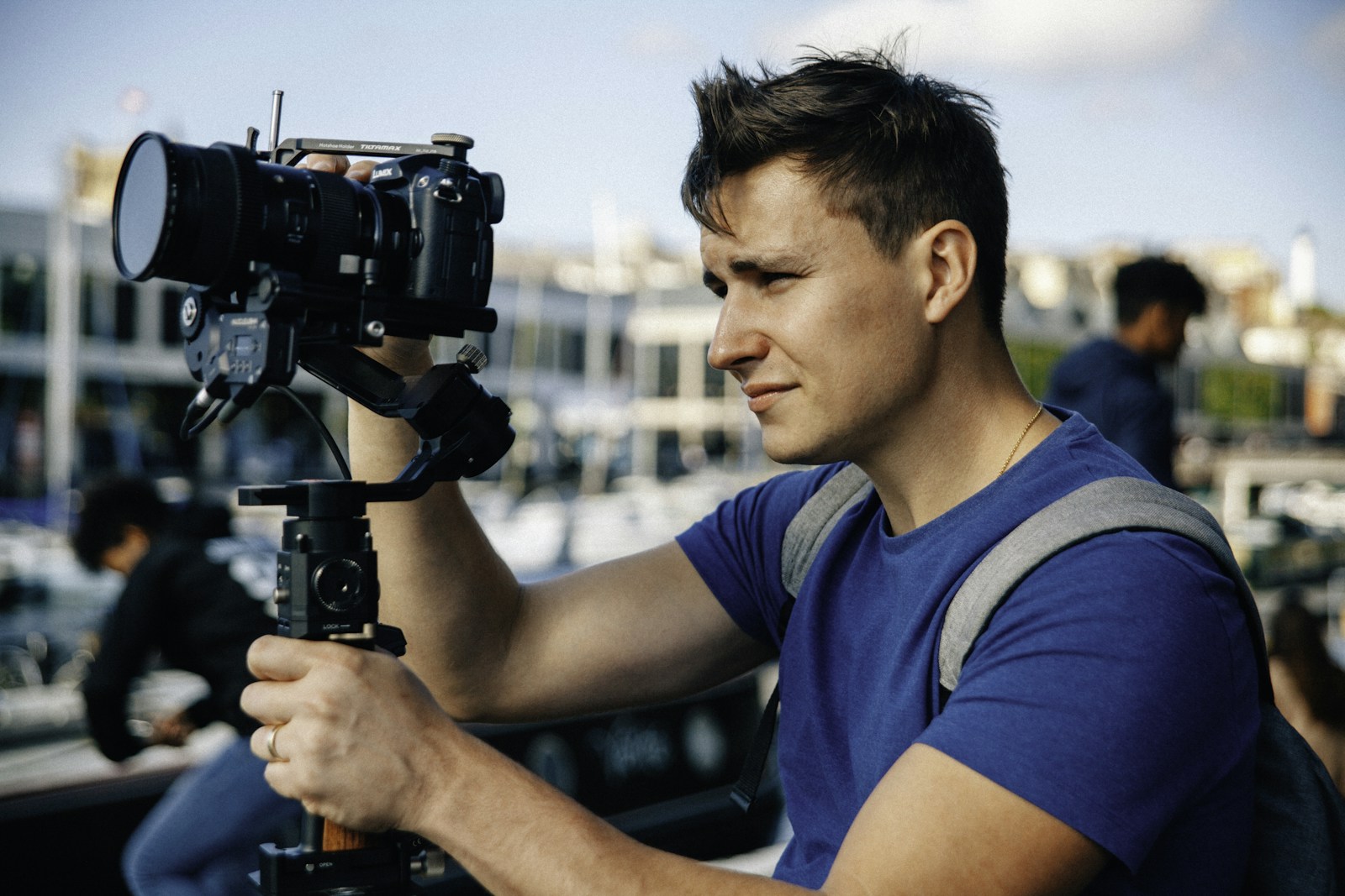 Filmmaker setting up a professional camera for content production